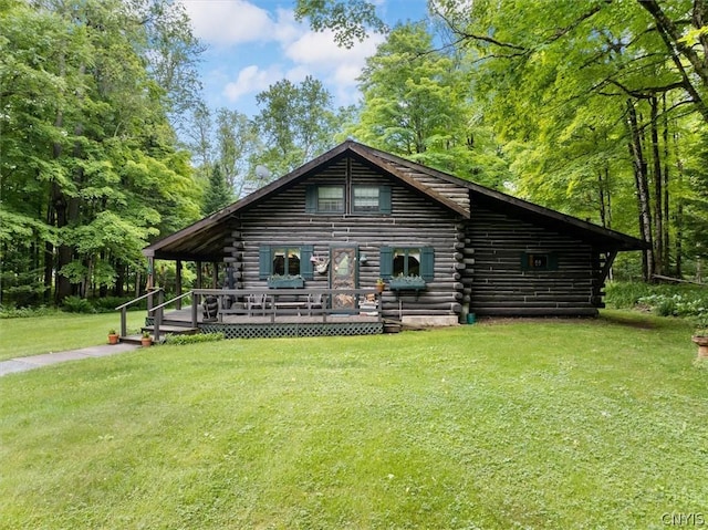 log home with a deck and a front lawn