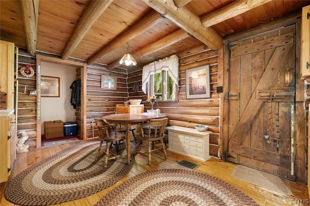 dining room featuring wooden ceiling, rustic walls, beam ceiling, and light hardwood / wood-style floors