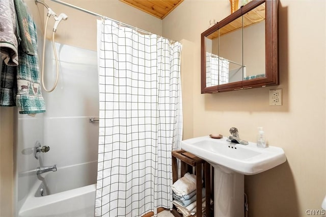 bathroom with wood ceiling and shower / tub combo