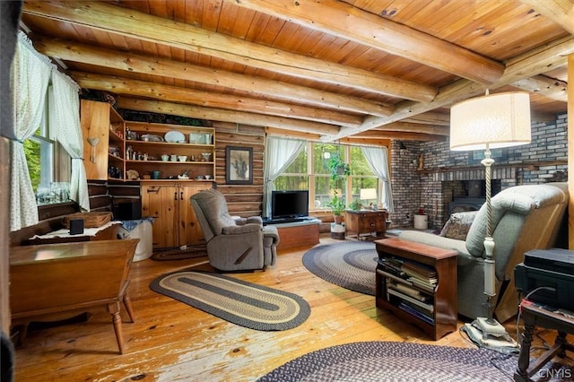 living area featuring wooden ceiling, beam ceiling, and light wood-type flooring