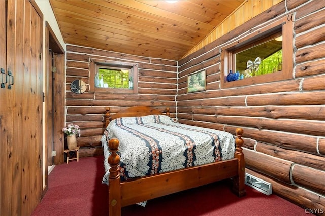 bedroom with wood ceiling, log walls, and vaulted ceiling