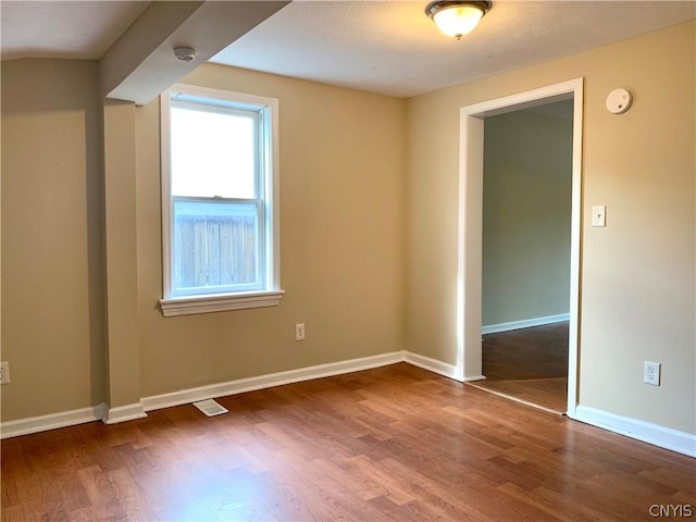 2739 State Route 48, Minetto, NY 13115 - unfurnished room with wood finished floors and a smoke detector