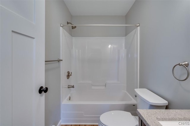 22218 Freedom Dr, Champion, NY 13619 - full bathroom featuring wood finished floors, toilet, vanity, and  shower combination