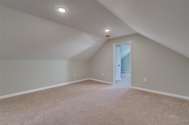 22218 Freedom Dr, Champion, NY 13619 - additional living space with baseboards, lofted ceiling, light colored carpet, and recessed lighting