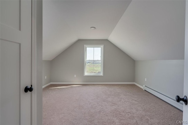 22218 Freedom Dr, Champion, NY 13619 - additional living space featuring a baseboard heating unit, vaulted ceiling, carpet flooring, and baseboards