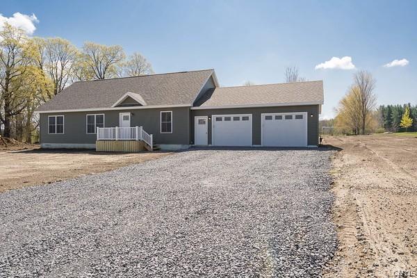 22218 Freedom Dr, Champion, NY 13619 - ranch-style house featuring driveway and a garage