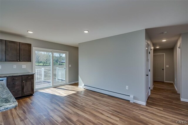 22218 Freedom Dr, Champion, NY 13619 - kitchen featuring dark brown cabinets, baseboards, wood finished floors, and a baseboard radiator