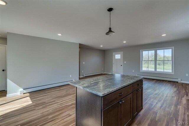 22218 Freedom Dr, Champion, NY 13619 - kitchen featuring a baseboard heating unit, open floor plan, baseboard heating, and light wood-style floors