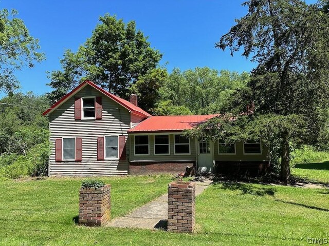 rear view of house with a lawn