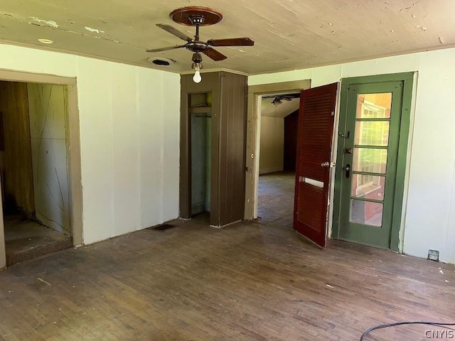 spare room featuring hardwood / wood-style floors and ceiling fan