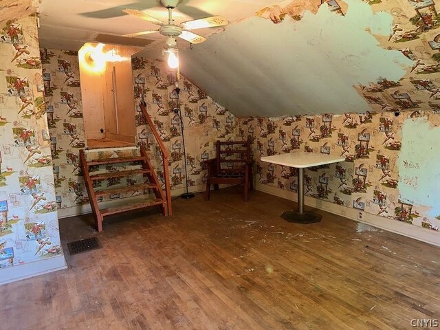 additional living space featuring ceiling fan, dark hardwood / wood-style flooring, and lofted ceiling