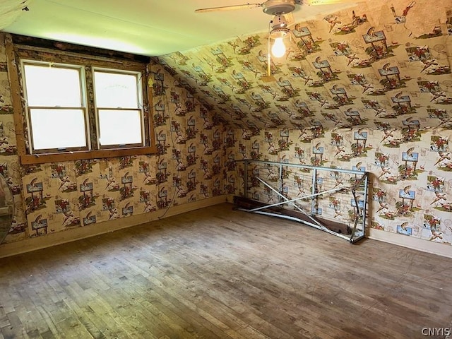 bonus room with hardwood / wood-style flooring and lofted ceiling