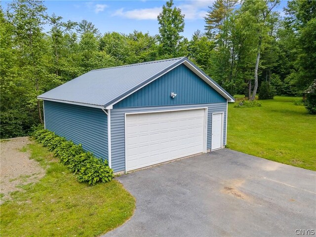 garage with a yard