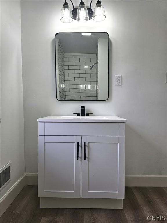 bathroom featuring vanity and hardwood / wood-style floors