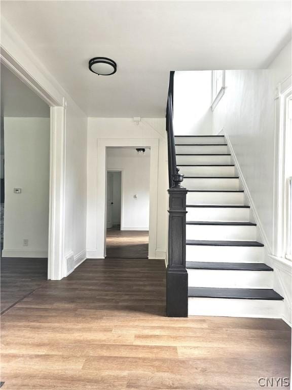 staircase featuring hardwood / wood-style flooring