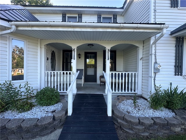 doorway to property featuring covered porch