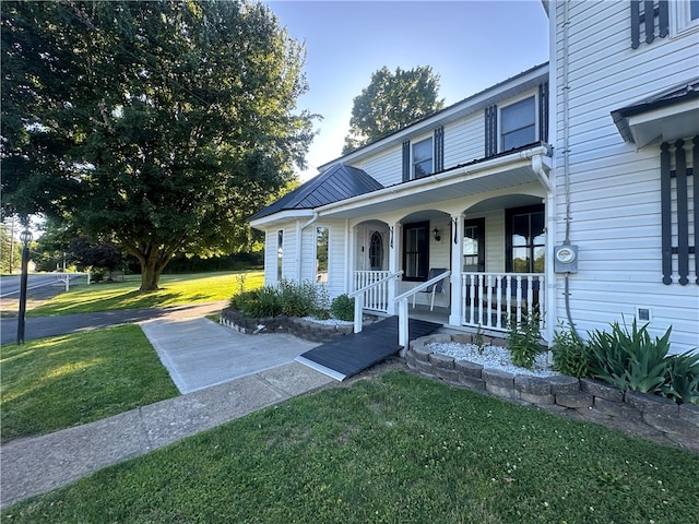 view of front of home with a front lawn and a porch