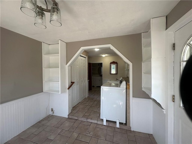 interior space featuring washing machine and clothes dryer, built in features, and sink