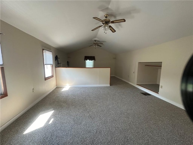 unfurnished room featuring carpet floors, ceiling fan, and lofted ceiling