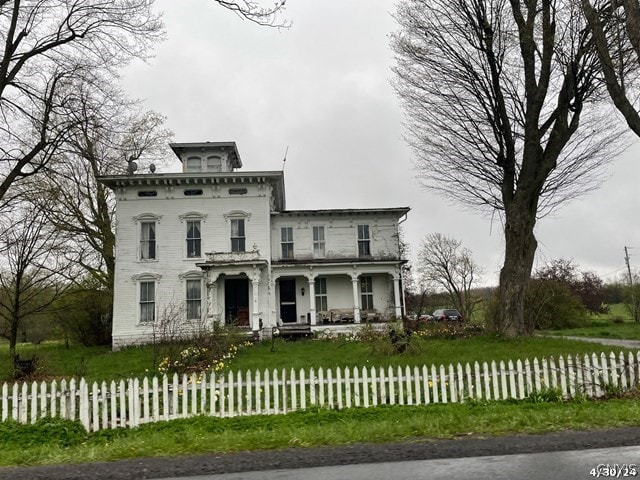 italianate home featuring covered porch