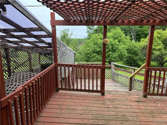 wooden deck featuring a pergola