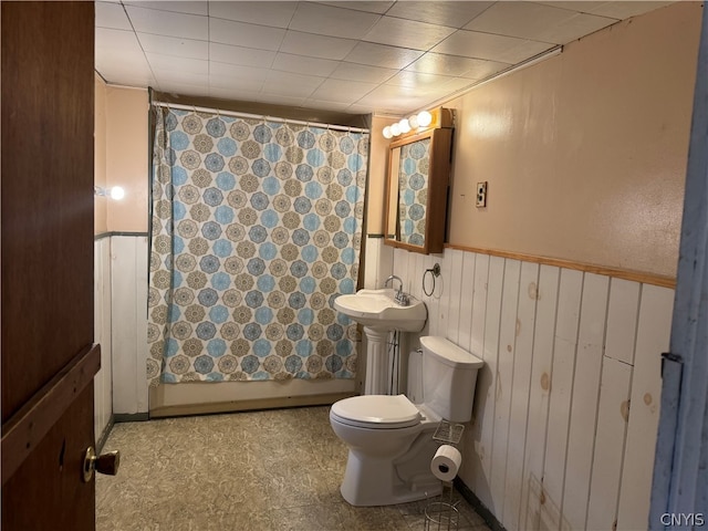 bathroom with toilet and tile floors