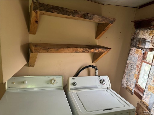 laundry room with separate washer and dryer and laundry area