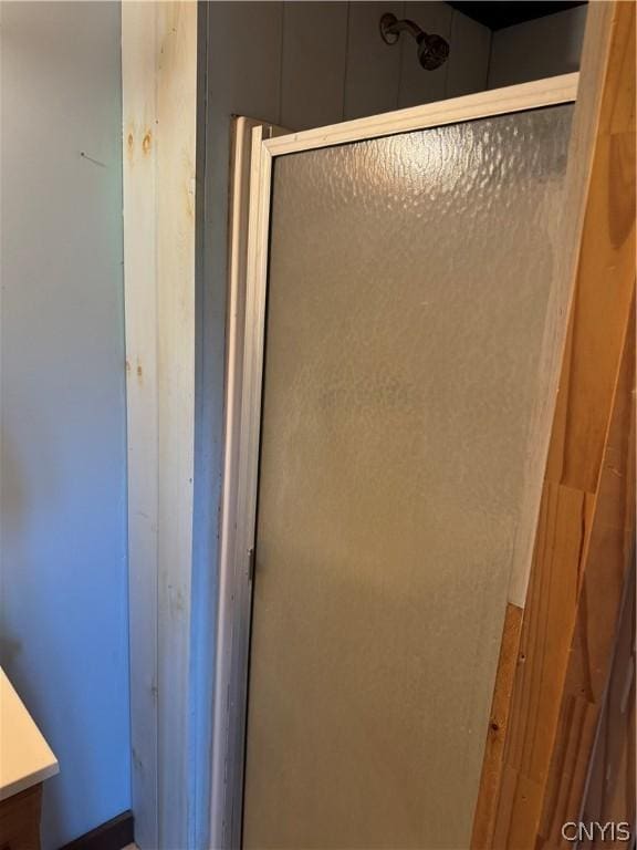 full bath featuring a shower stall and vanity