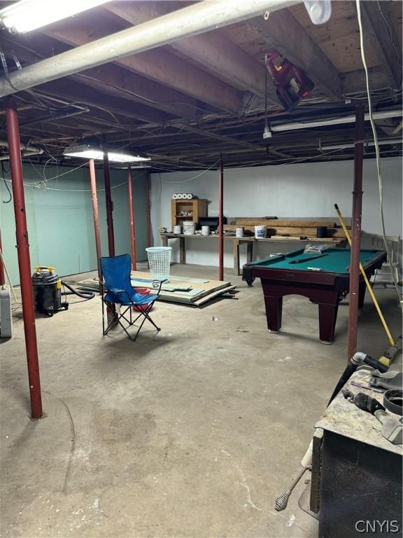 unfinished basement with billiards