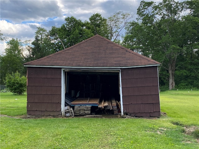 view of outdoor structure featuring a lawn