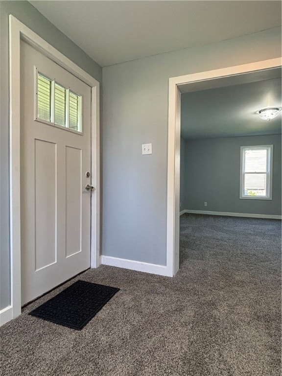 view of carpeted foyer