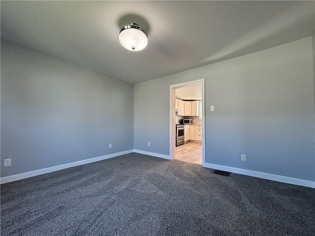 unfurnished bedroom featuring light carpet