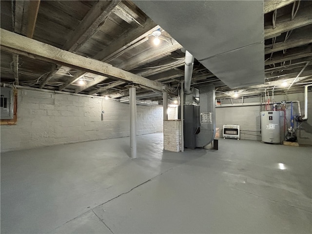 basement featuring heating unit, water heater, and electric panel