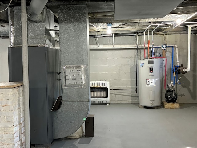 utility room featuring water heater and heating unit