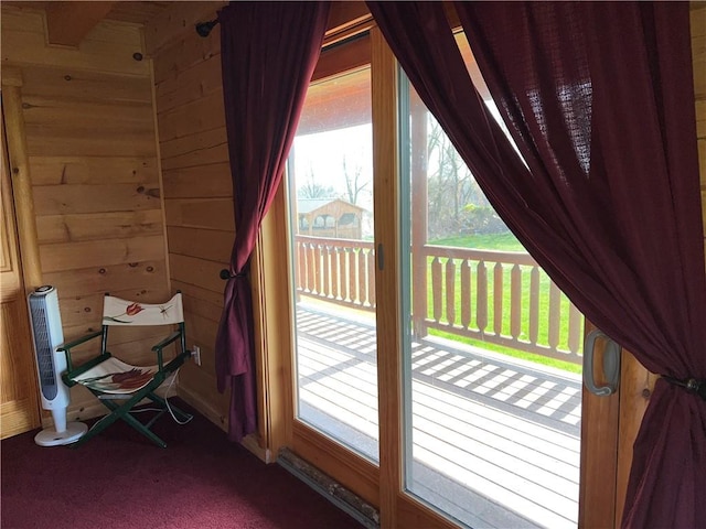 entryway with wood walls