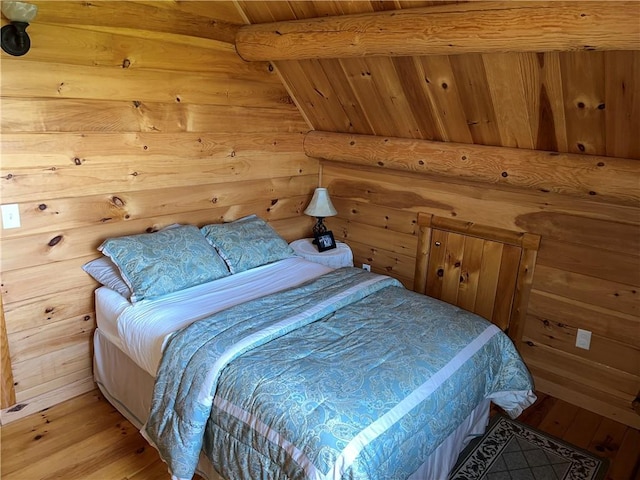 bedroom featuring wood walls and wood-type flooring