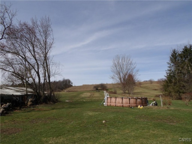 view of yard with a rural view