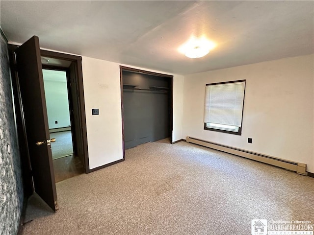 unfurnished bedroom featuring baseboard heating, light carpet, and a closet