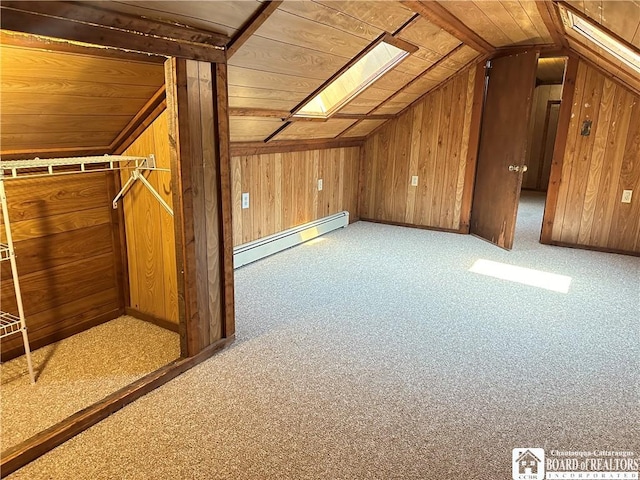 bonus room featuring lofted ceiling with skylight, baseboard heating, and wooden ceiling