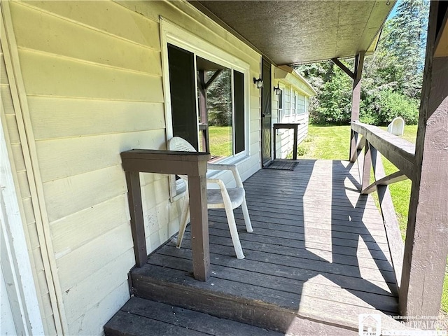 wooden terrace with a porch