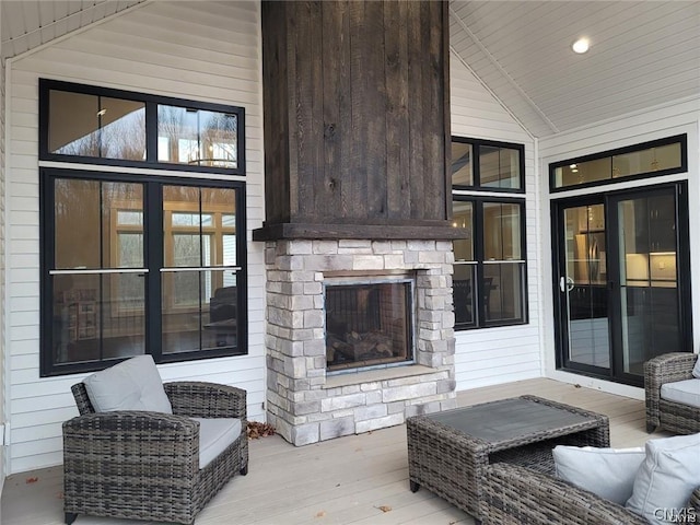 view of patio featuring a stone fireplace