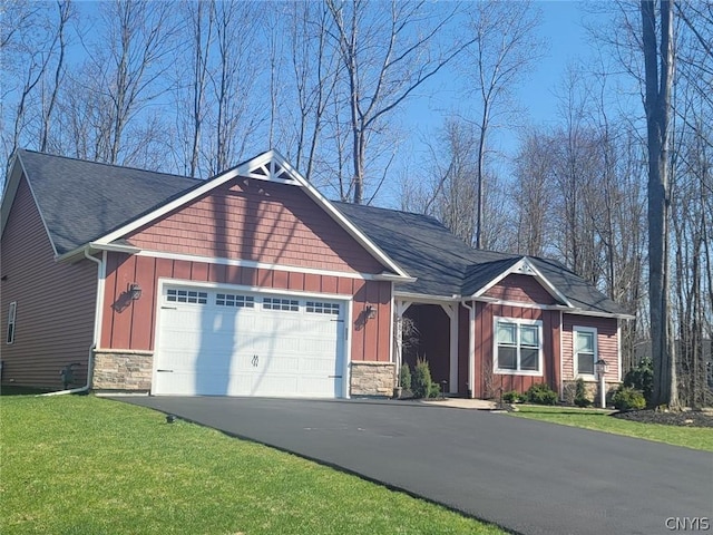 craftsman-style home featuring a front yard and a garage