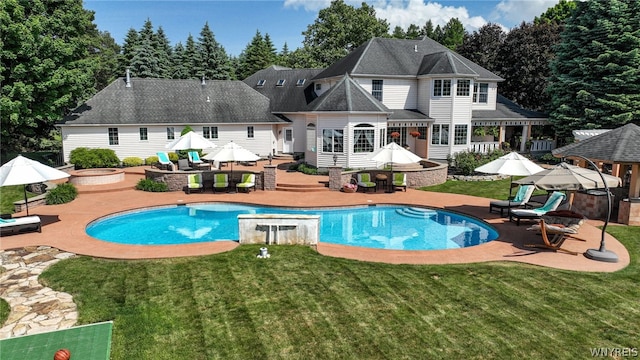 back of property with an outdoor pool, a patio area, outdoor dining area, and a yard