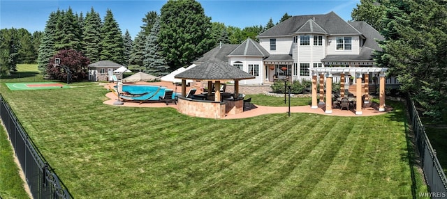 view of jungle gym with a yard, fence, a pergola, and a gazebo