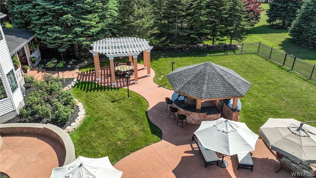 view of yard featuring outdoor dining space, a fenced backyard, a patio, and a gazebo