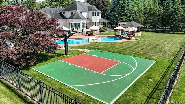 view of basketball court with a fenced in pool, a yard, basketball hoop, a gazebo, and fence private yard