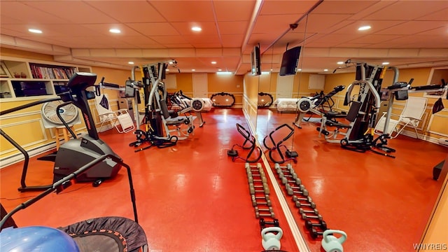 workout area featuring a paneled ceiling and recessed lighting