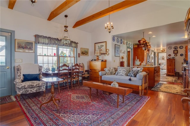 living room featuring beamed ceiling, wood-type flooring, high vaulted ceiling, and a chandelier