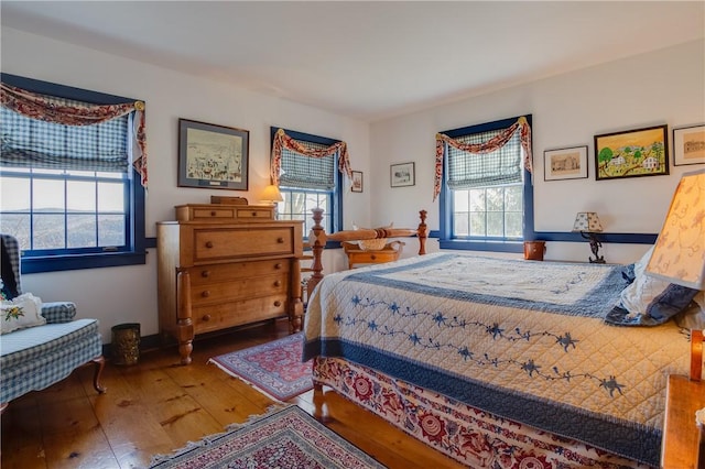 bedroom with wood-type flooring