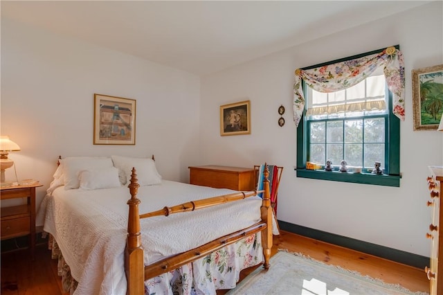 bedroom featuring hardwood / wood-style floors